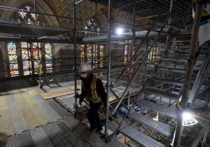 A worker climbs scaffolding in the chamber of the House of Commons -Milenio Stadium-Canada