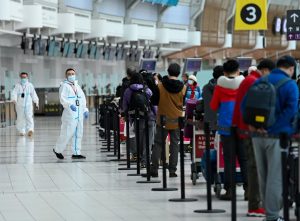 People line up and check in for an international flight at Pearson International airport-Milenio Stadium-Canada