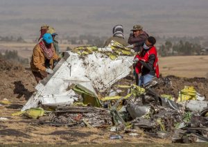 Rescuers work at the scene of the Ethiopian Airlines plane crash south of Ethiopia-Milenio Stadium-Canada