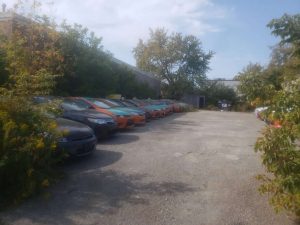 Several taxis are parked in a lot in September-Milenio Stadium-Ontario