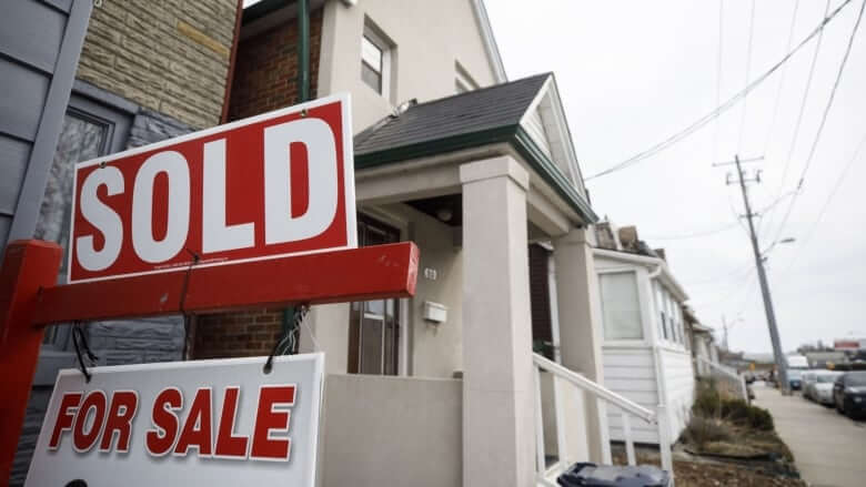 A Sold sign is displayed on a Toronto-area home that sold in March. Canadian home sales and prices soared to record highs that month, but have slowly fallen every month since. (Cole Burston/Bloomberg)