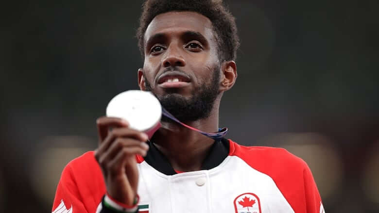 Moh Ahmed wins his 1st Olympic track medal, earning silver for Canada in men's 5,000m-Milenio Stadium-Canada