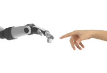 human-hand-and-robot-2022-12-16-04-27-51-utc