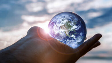 planet-earth-globe-crystal-ball-in-palm-of-hand-be-2022-11-14-06-53-31-utc - milenio stadium