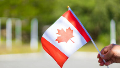 female-hand-holding-canadian-flag-to-celebrate-the-2022-01-30-01-30-22-utc