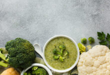 flat-lay-broccoli-bisque-cauliflower-bowl-with-copy-space