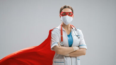doctor-wearing-facemask-and-superhero-cape-2023-11-27-05-20-18-utc