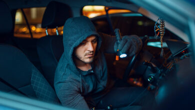professional-car-thief-with-flashlight-2023-11-27-05-36-05-utc