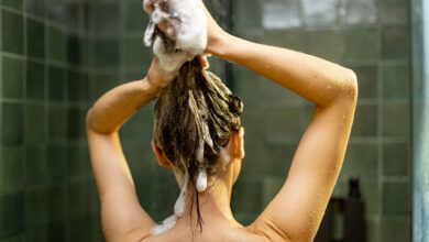 woman-taking-shower-relaxing-under-warm-water-2023-11-27-05-16-47-utc